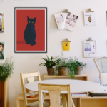 Minimalist poster featuring a sleek black cat design.